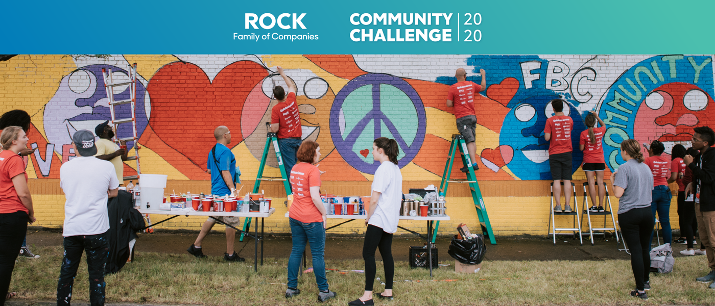 Community Challenge team members painting a mural