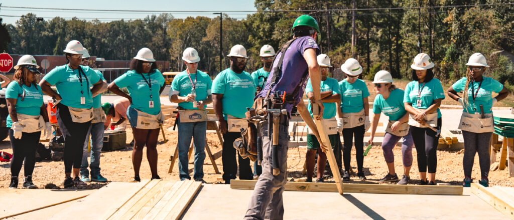 Habitat for Humanity volunteers breaking ground for a home build